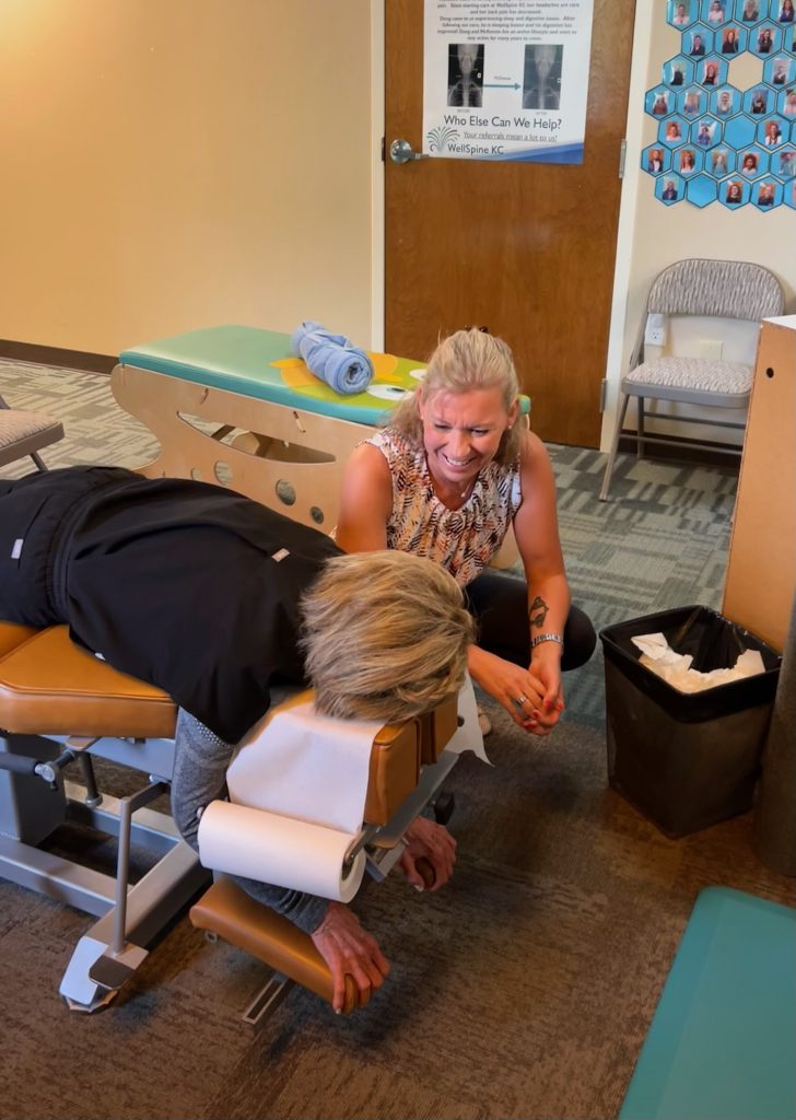 Dr. Liisa Hall talking with patient